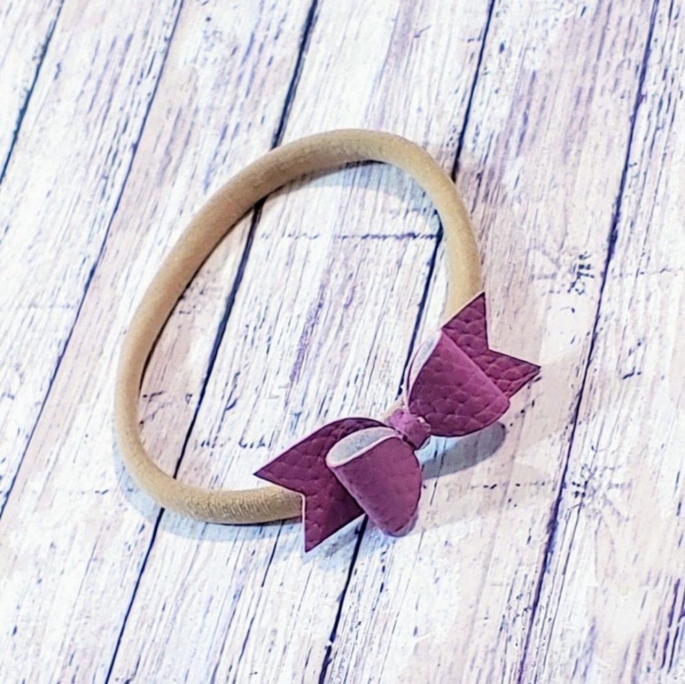 Headband with bow attached